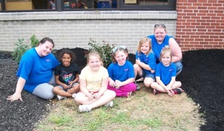 Girl Scouts troop after planting