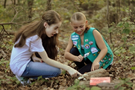 Kids examine fallen log