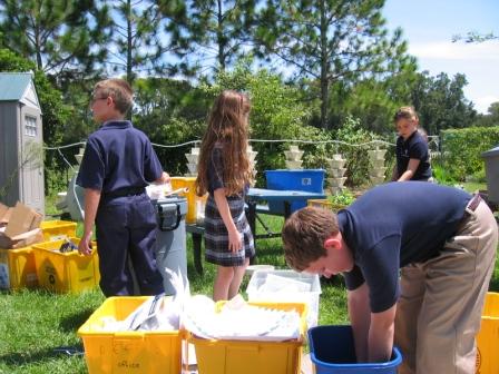 Students collect materials for recycling