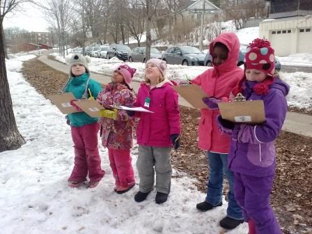 Students listen for sounds of nature and record what they hear.