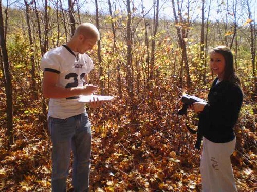 high-school-students-taking-notes-in-woods