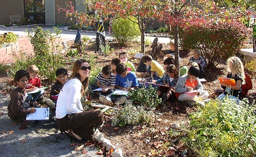 Bicentennial-elementary-school-students-and-teacher-drawing-in-school-yard