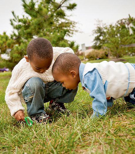 Boys playing in grass