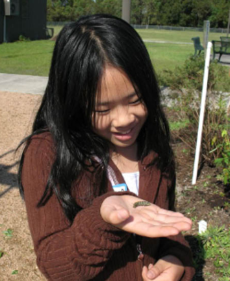 Girl holding a caterpillar
