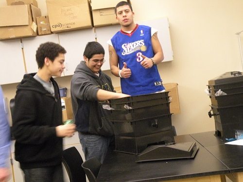 High school students and worm compost bins