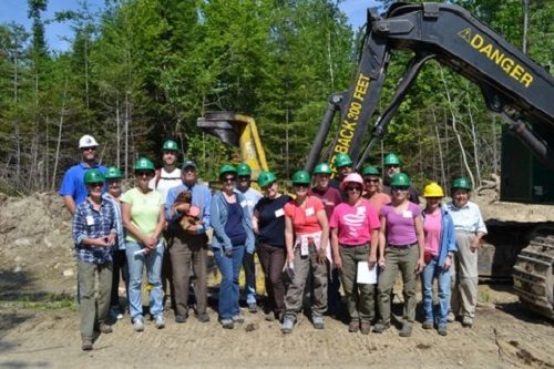 Teachers-outside-in-front-of-bulldozer