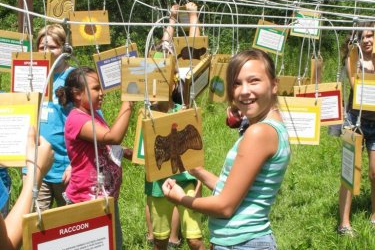 Two students outside participating in a web of life activity