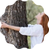 woman hugging tree