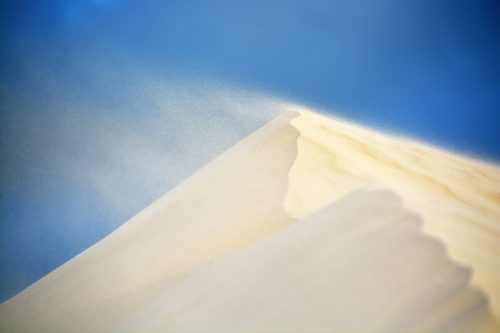 wind-carries-particles-of-sand-off-of-a-dune