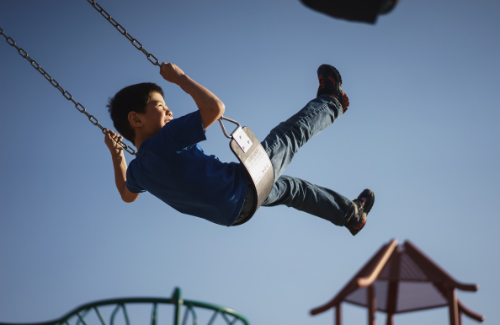 young-boy-on-swingset