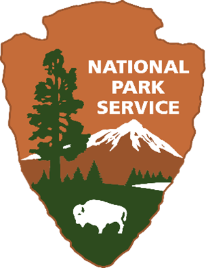 brown arrowhead shaped national park service shield