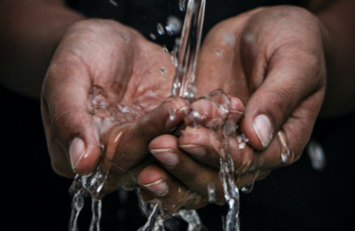 hands cupping flowing water