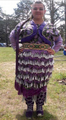 young woman in a purple jingle dress 