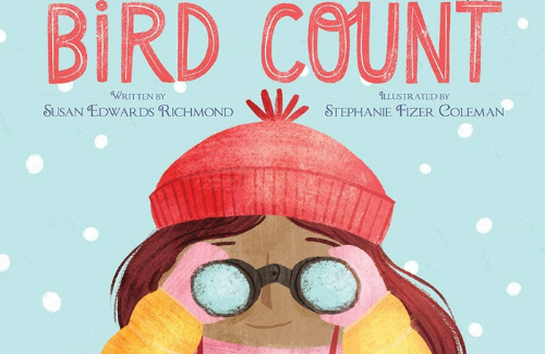 The front cover of the book Bird Count. A young girl wearing a red winter hat, yellow coat, and pink scarf looking into binoculars.
