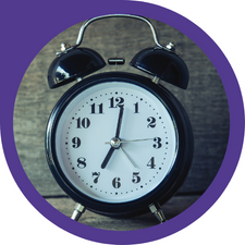 photo of an alarm clock with a purple border