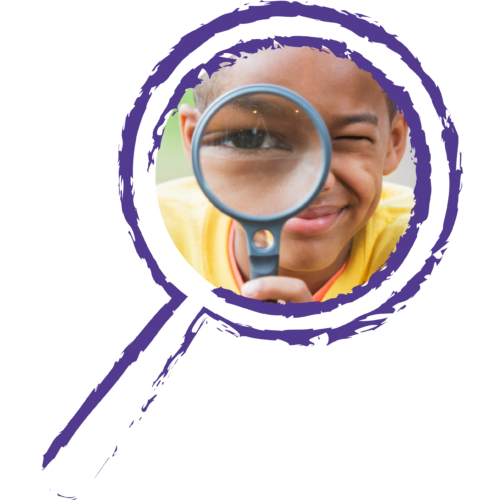 Boy looking through magnifying glass