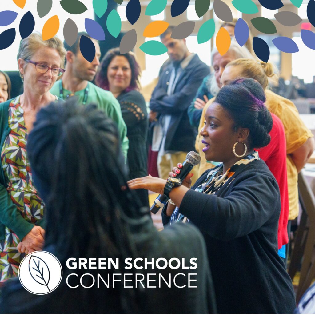 an image of people listening to a speaker at the green schools confernece